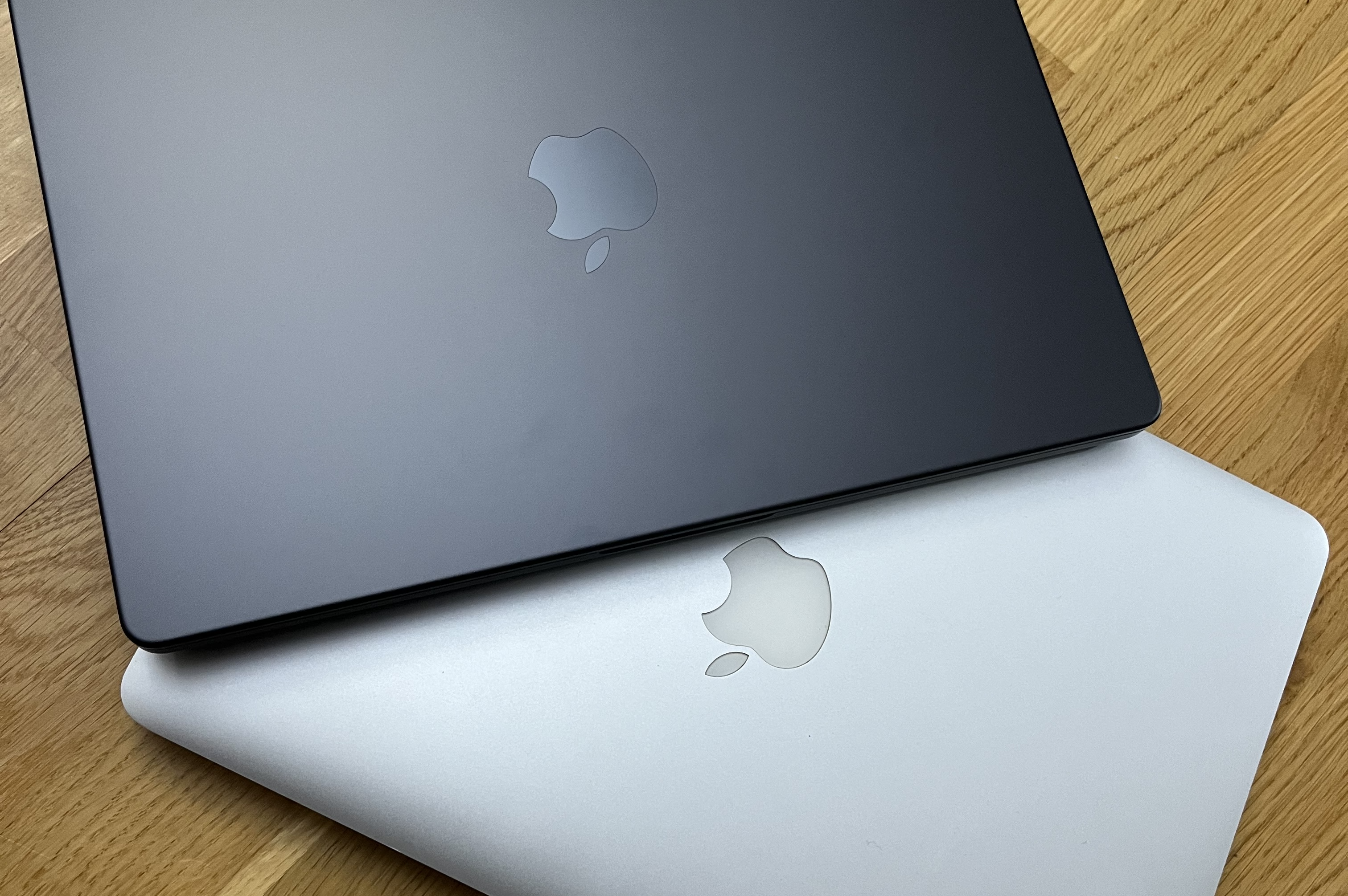 A 2025 Macbook on top of a 2015 Macbook